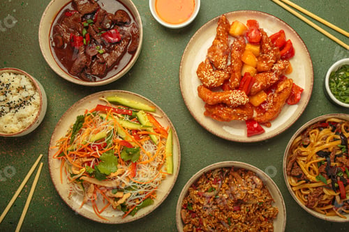 Preview: Variety of Chinese food dishes top view on table with chopsticks, cuisine of China