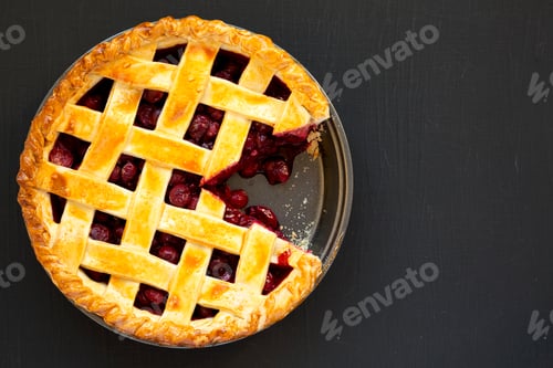 Preview: Yummy Homemade Cherry Pie on black background, top view. Flat lay, overhead, from above. Copy space.