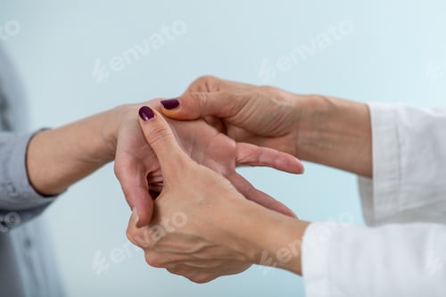 Preview: A medical professional conducts a comprehensive Carpal Tunnel Syndrome test with a senior woman,