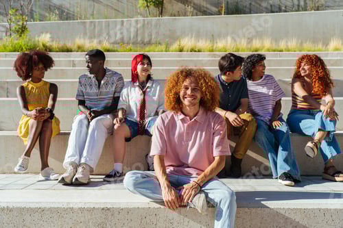 Preview: Smiling Friends Relaxing Together Outside on Sunny Day