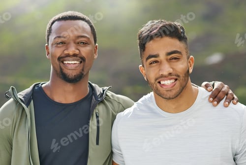 Preview: Its much more fun to train together. Portrait of two sporty young men exercising together outdoors.