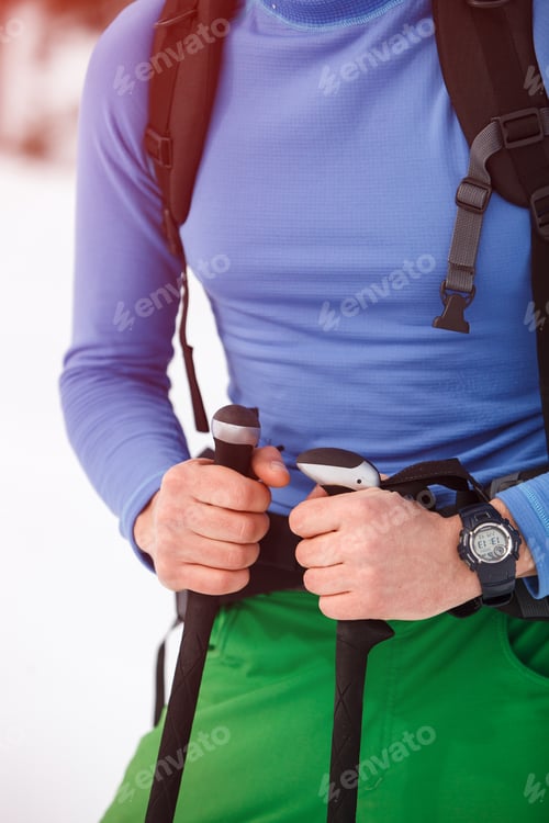 Preview: Hiker's hands closeup on mountain snow