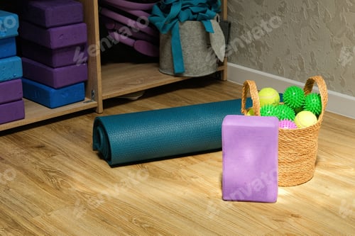 Preview: Yoga accessories in gym or sport studio, yoga block, massage balls and a mat