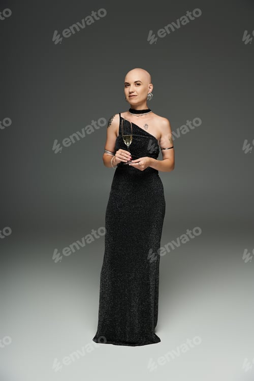 Preview: A confident young woman embracing her uniqueness in a stunning black dress during a portrait session