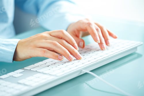 Preview: Woman office worker typing on the keyboard