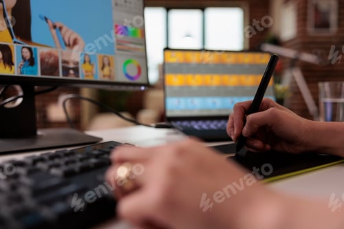 Preview: Female editor using stylus on graphic tablet
