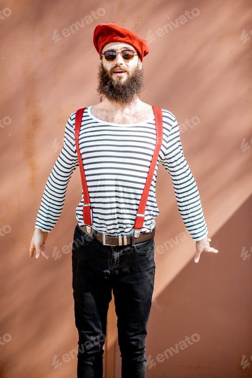 Preview: Portrait of a stylish man on the red background