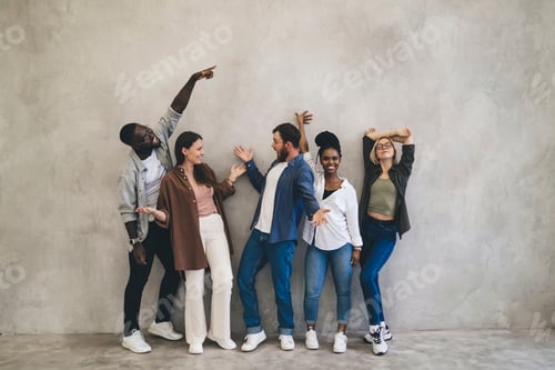 Preview: Enthusiastic Friends Expressing Happiness Posing Near Wall