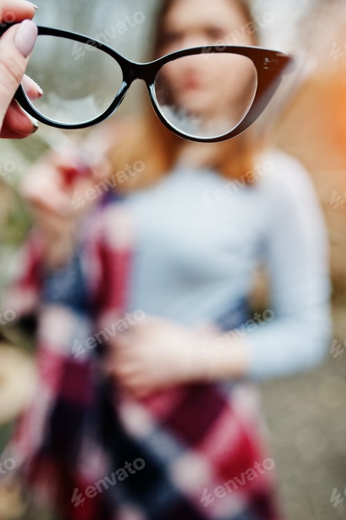 Preview: Girl gives her friend glasses, soft focus. Bad eye vision of people.