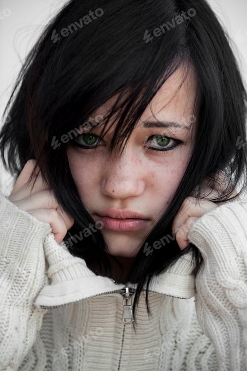 Preview: Sad girl in sweater.