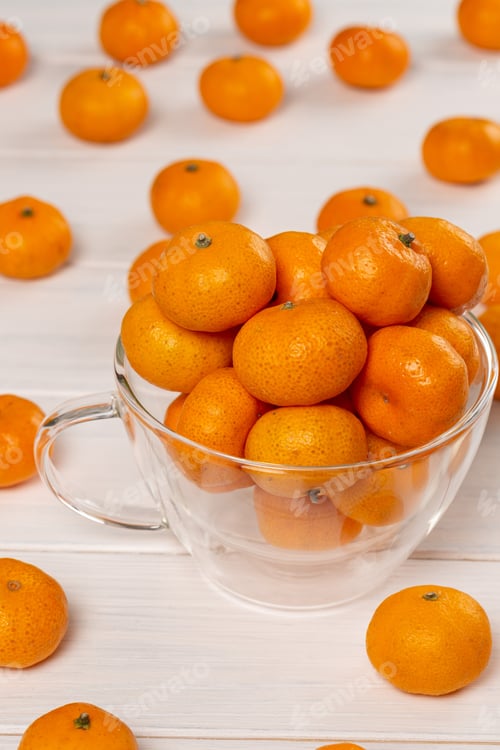 Preview: Bright Tangerines in a Glass Cup