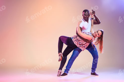 Preview: Young Couple Dances Social Caribbean Salsa, Studio Shot