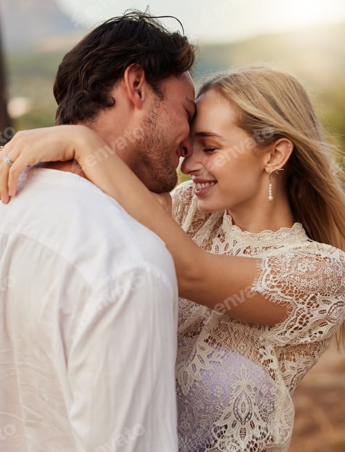 Preview: Couple, love and hug outdoor with a smile, care and romance on date in nature. Young man and woman