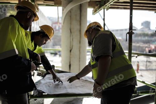 Preview: Construction workers looking at plans