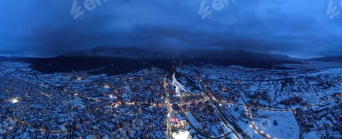 Preview: A mesmerizing winter aerial view of Bansko, Bulgaria, showcasing snow-covered rooftops, the majestic