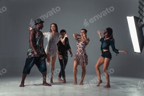 Preview: Adults Enjoying Dancing in Artificial Rain Studio