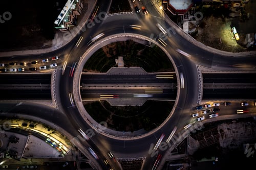 Preview: Aerial drone top view of a modern motorway junction roundabout with cars moving. Transportation