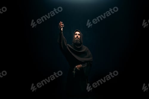 Preview: Medieval monk kneeling and praying, religion