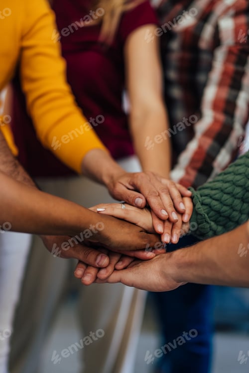 Preview: Group of Hands Joined Together Symbolizing Unity and Teamwork
