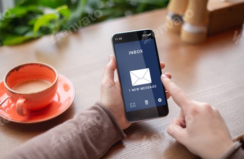 Preview: Lady Holding Phone Reading New E-Mail Message Sitting In Cafe