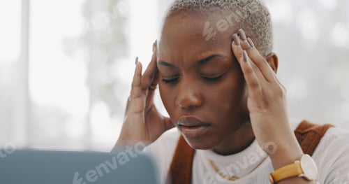 Preview: Stress, burnout and headache of black woman on laptop typing email in office at marketing company.
