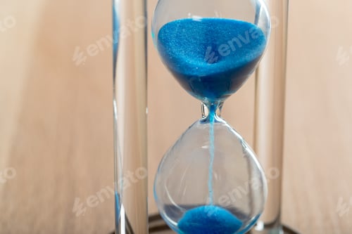 Preview: Time is passing. Blue hourglass close up