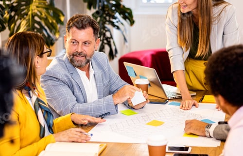 Preview: Group of business people working in office.
