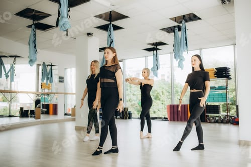 Preview: Group of sportive people in a gym training - Multiracial group of athletes stretching before