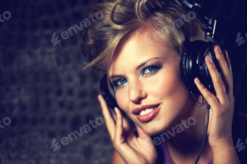 Preview: Her beats will blow your mind. Shot of a gorgeous young female dj.