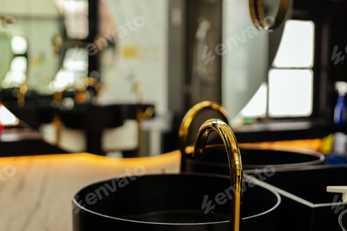 Preview: The scene shows black sinks with gold faucets arranged in a modern room.