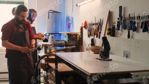 Preview: Craftsperson in joinery using vice tool to clamp piece of wood