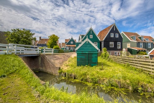 Preview: Characteristic Dutch village scene with wooden houses and bridge