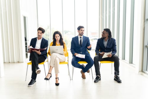 Preview: Businesswoman and Businessman Sitting in Office, Discussing Employment Opportunities