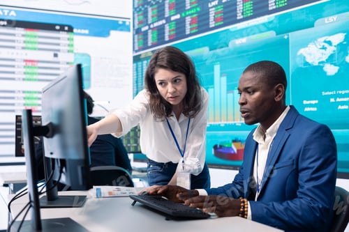 Preview: Business associates evaluating key performance indicators within the company