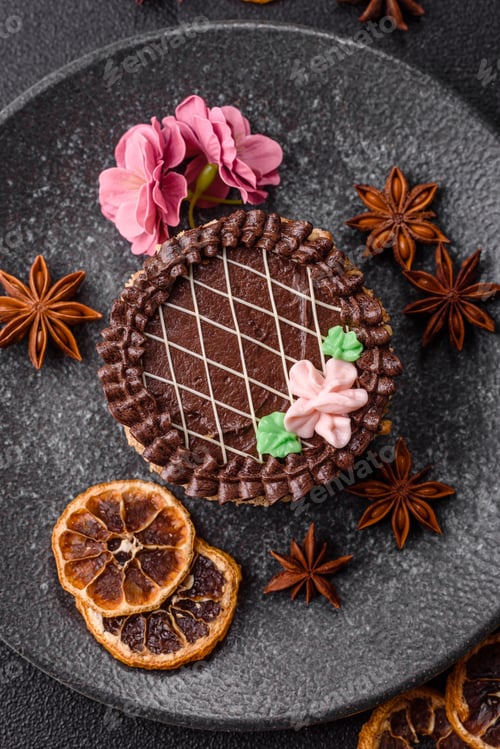 Preview: Sweet tart, pie with chocolate and cream with fruit filling on a plate. Chocolate tart