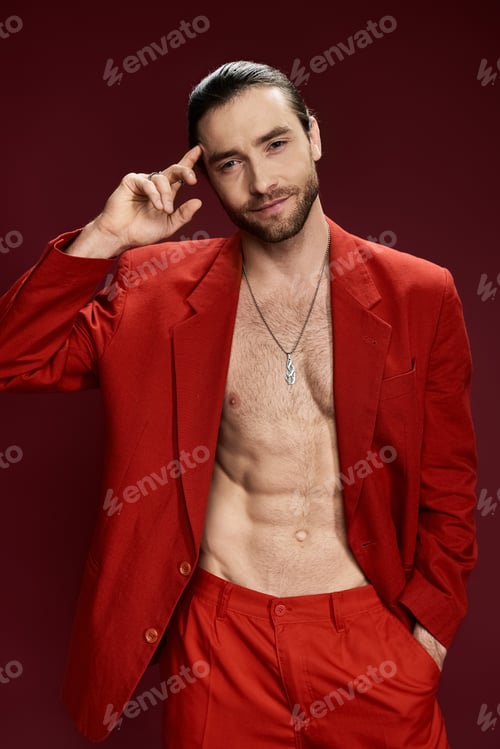 Preview: Vibrant man in red suit strikes a pose