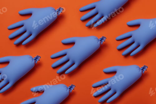 Preview: Blue medical gloves on orange background, top view