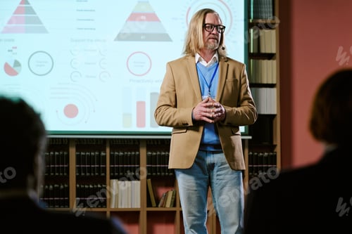 Preview: Middle Aged Caucasian Man Giving Presentation in Front of Business Audience