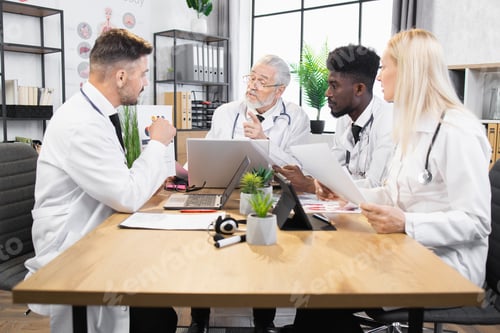 Preview: Four doctors discussing results of scientific researchers