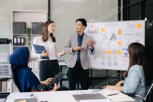Preview: Creative business people working on business project in office