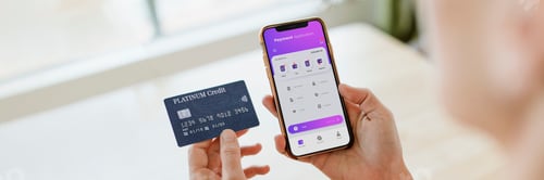 Preview: Woman using a mobile phone mockup to shop online during coronavi