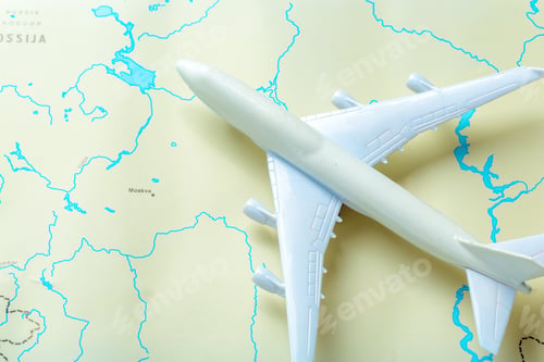 Preview: miniature of a passenger aircraft flying on a map