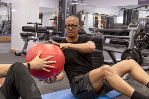 Preview: People doing exercises with a medicine ball