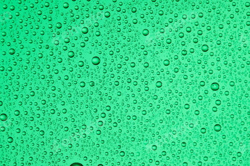 Preview: Drops on glass of different sizes and colors on a colored background, texture