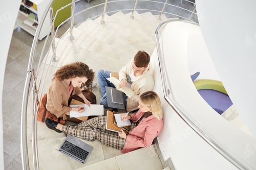 Preview: Students Sitting on Stairs in College