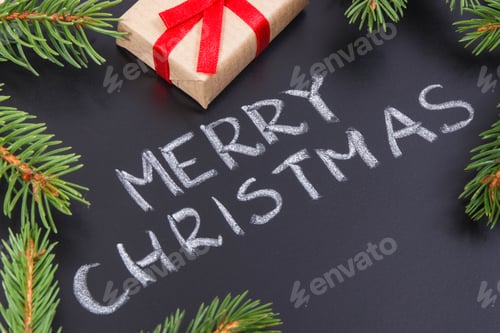 Preview: Inscription Merry Christmas, wrapped gift and spruce branches