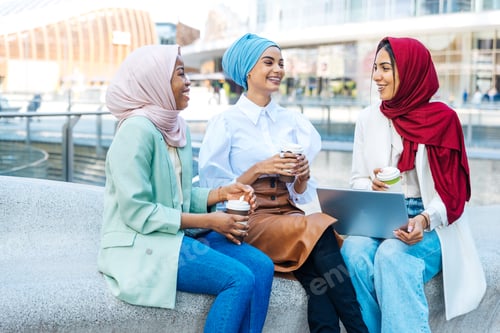 Preview: Beautiful muslim girl wearing hijab bonding outdoors