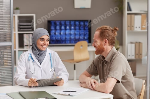 Preview: Muslim doctor with patient at hospital