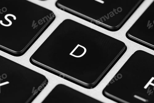 Preview: Closeup shot of a grey keyboard layout with black keys and white font