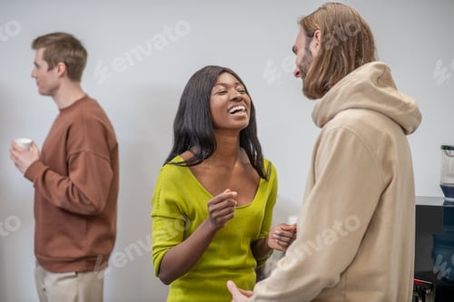 Preview: A group of colleagues discussing something and looking involved